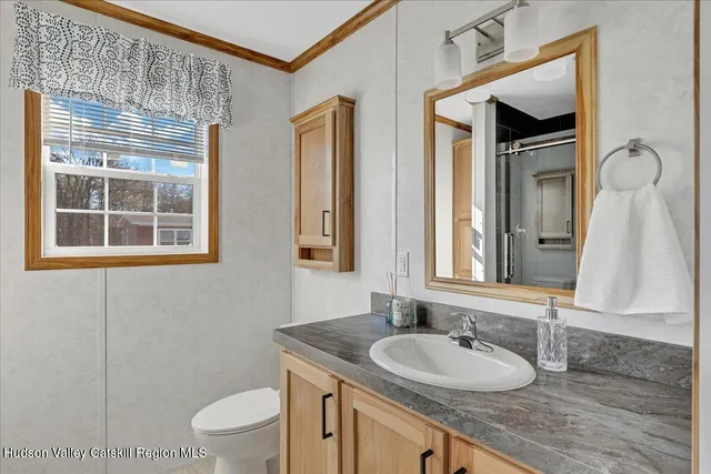 a bathroom with a shower and a sink