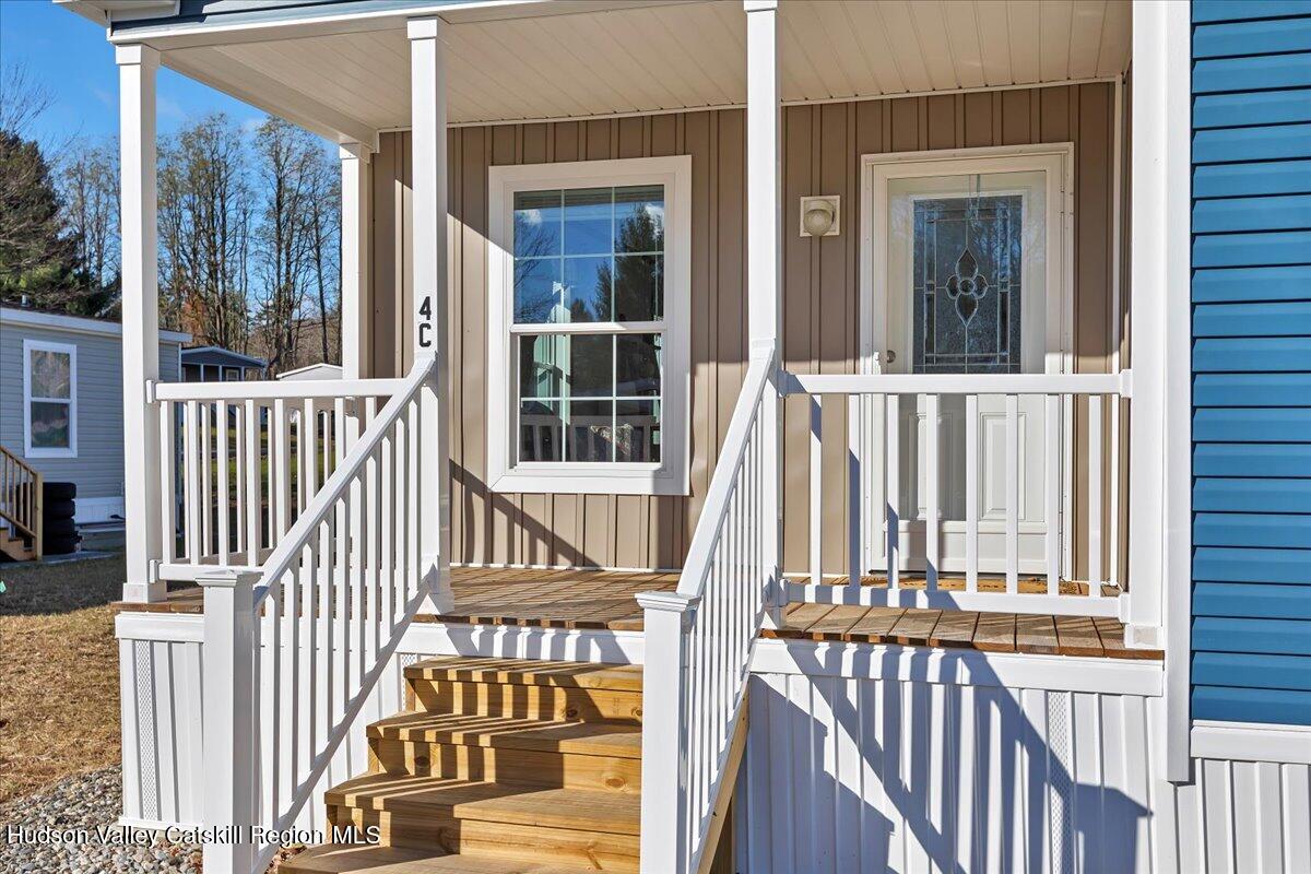 299 Hyspot Road, Unit 4C Greenfield, NY 12833 - Photo 6 of 41 a view of a house with a small deck