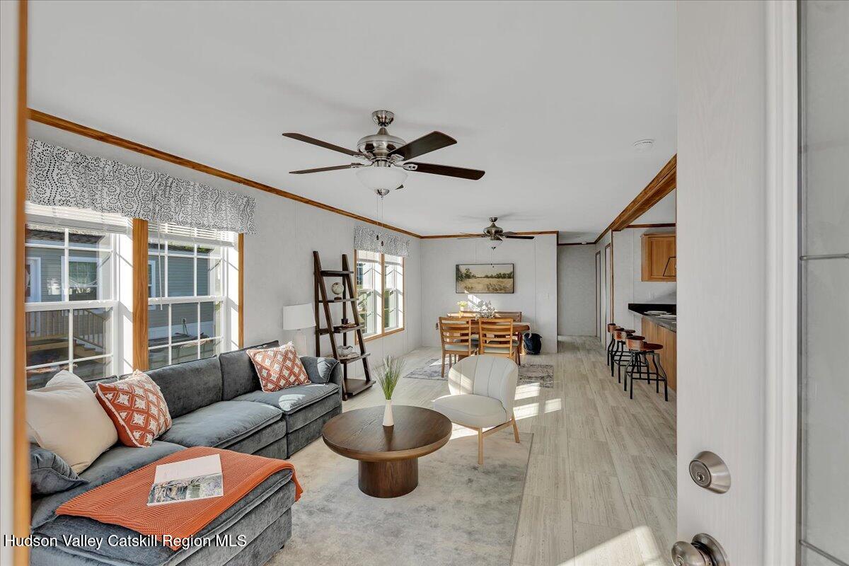 299 Hyspot Road, Unit 4C Greenfield, NY 12833 - Photo 8 of 41 a living room with furniture and a large window