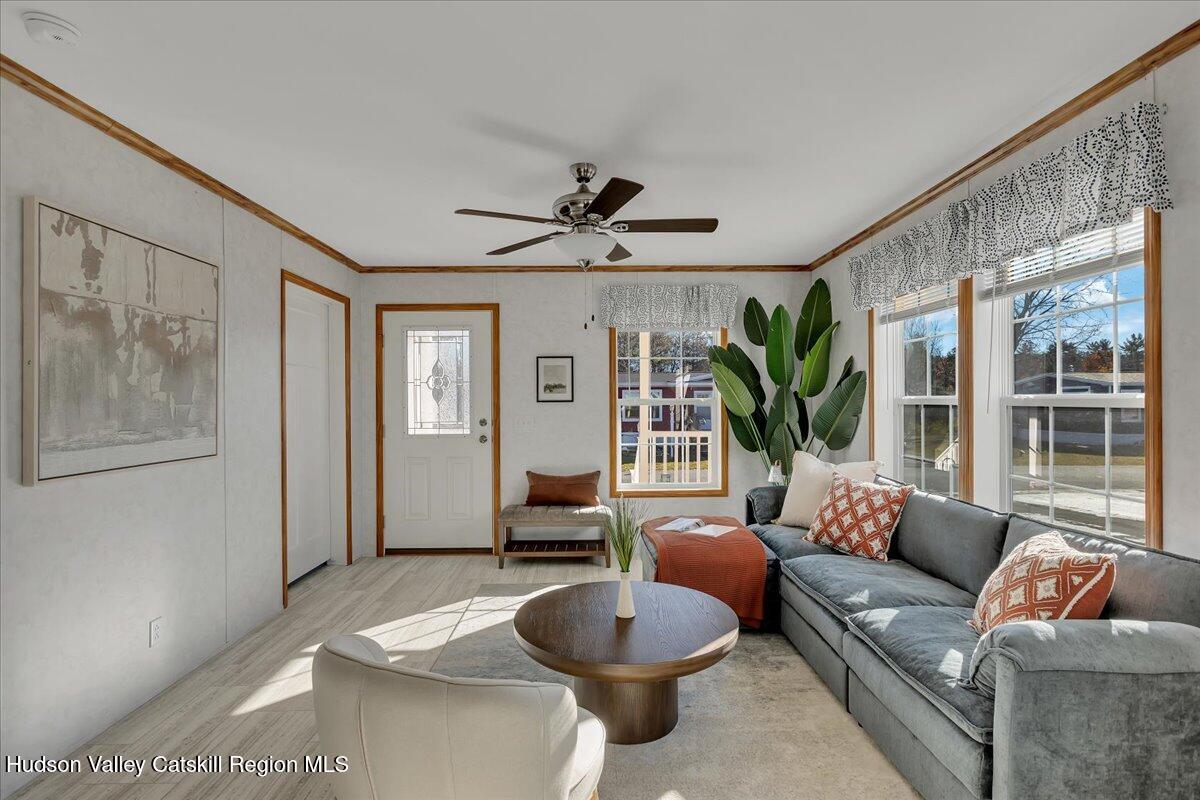 299 Hyspot Road, Unit 4C Greenfield, NY 12833 - Photo 10 of 41 a living room with furniture and a large window