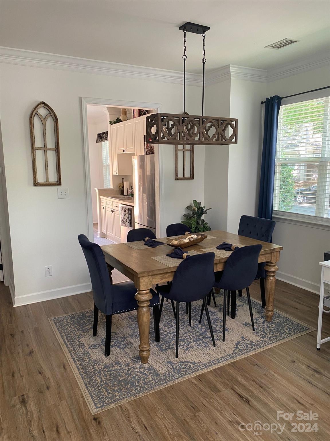 18225 Taffrail Way Cornelius, NC 28031 - Photo 12 of 30 a view of a dining room with furniture window and wooden floor