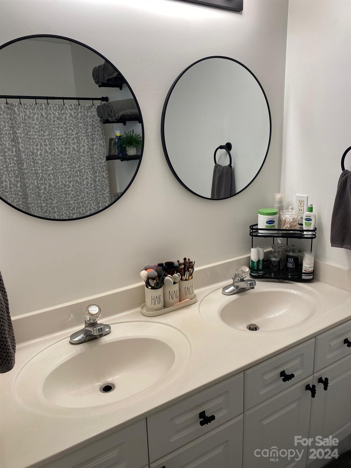 18225 Taffrail Way Cornelius, NC 28031 - Photo 16 of 30 a bathroom with a sink and a mirror