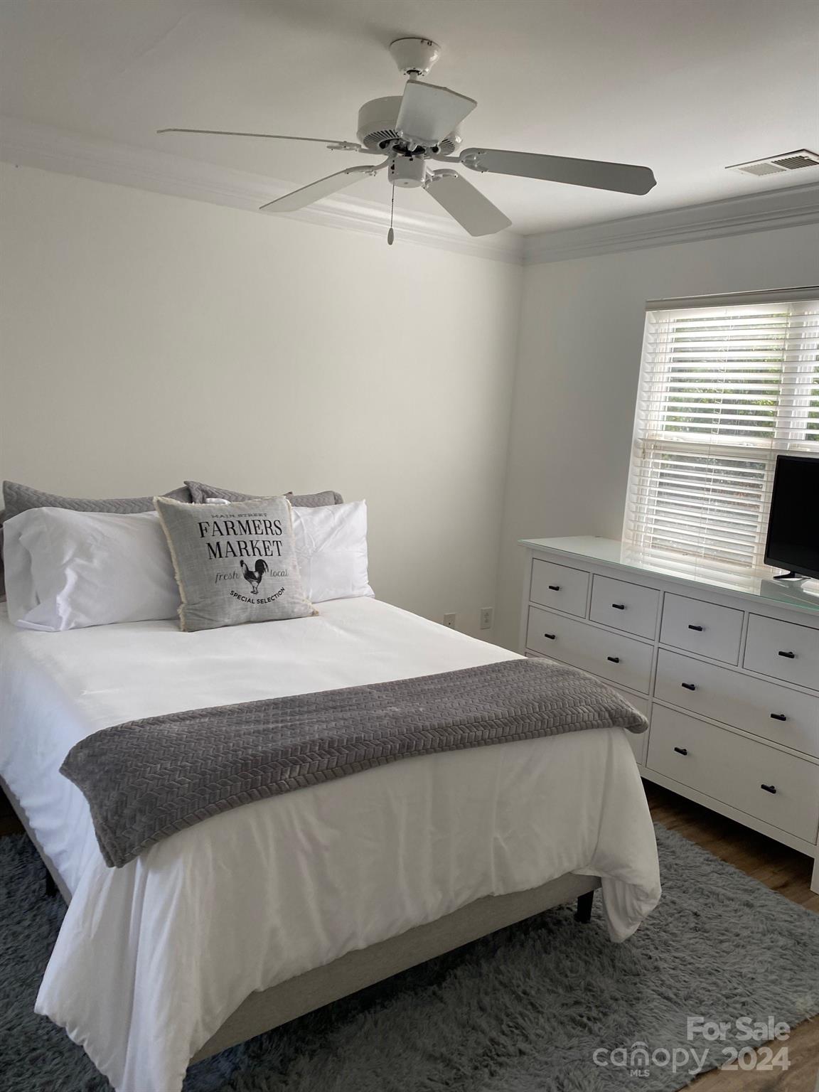 18225 Taffrail Way Cornelius, NC 28031 - Photo 20 of 30 a bedroom with a bed and window