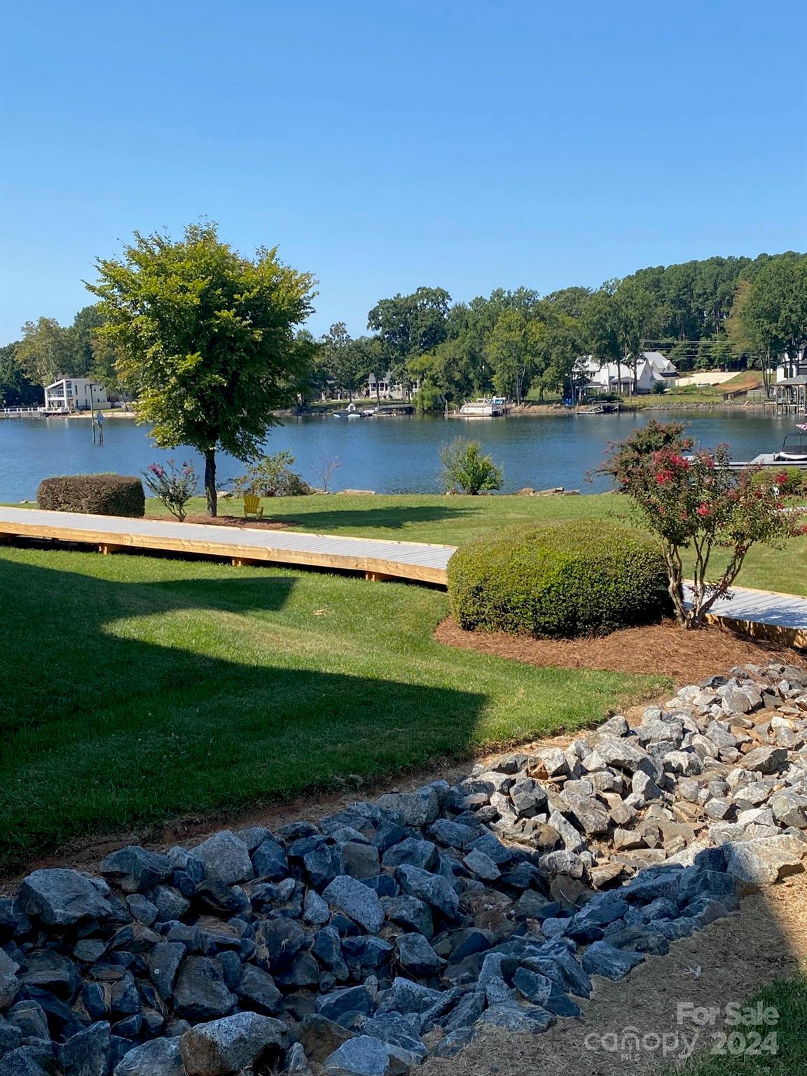 18225 Taffrail Way Cornelius, NC 28031 - Photo 27 of 30 a view of a garden with a lake view