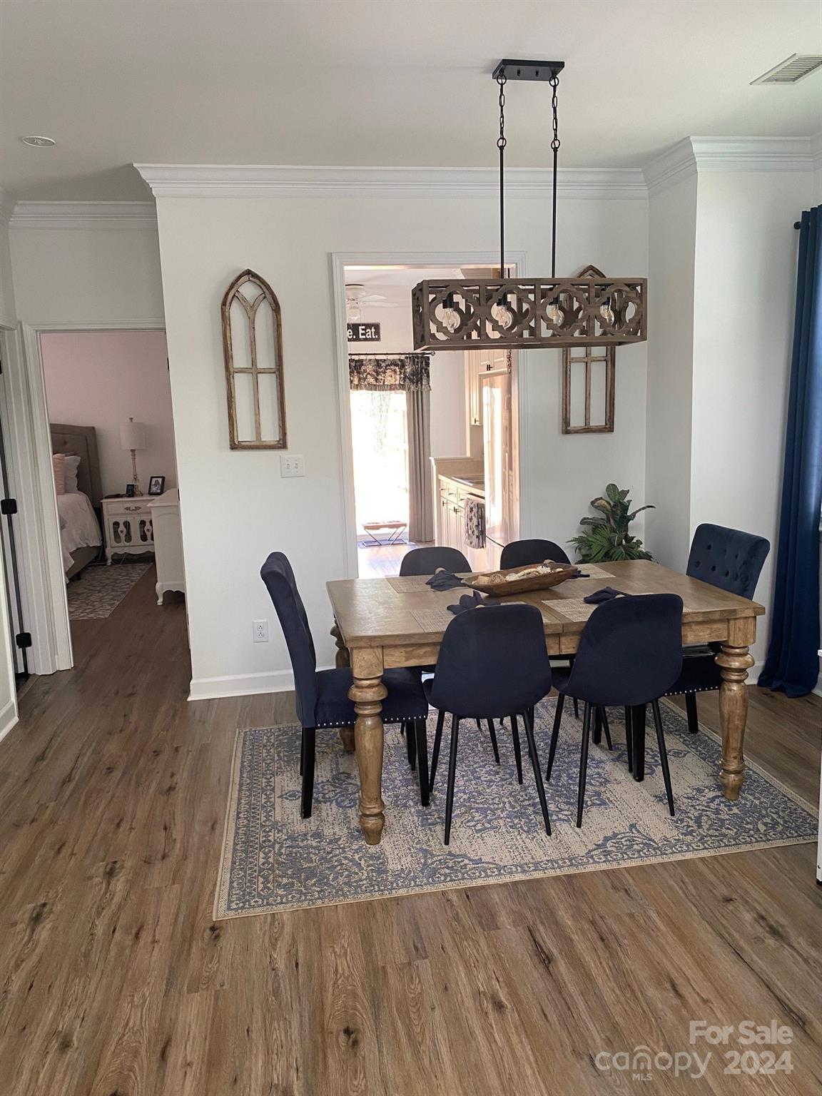18225 Taffrail Way Cornelius, NC 28031 - Photo 9 of 30 a view of a dining room with furniture window and wooden floor