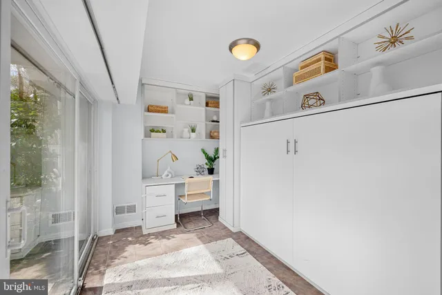 a view of a hallway to rooms and stairs