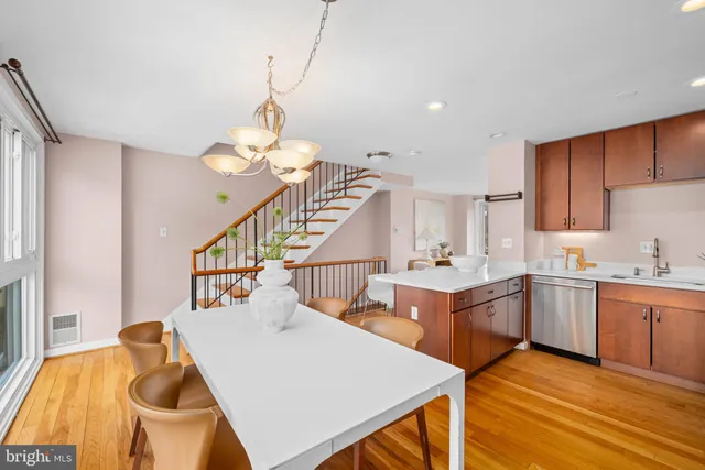 a very nice looking dining room with a table and chairs