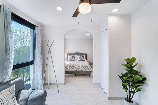 a living room with furniture and a window