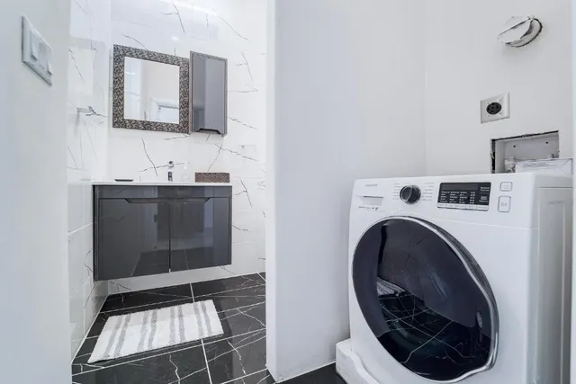 a bedroom with a bed a table and chair