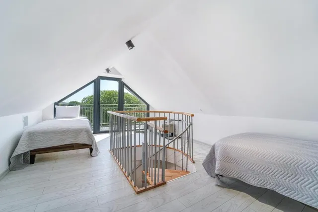 a view of staircase with a potted plant and a window