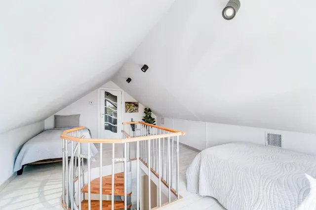 a view of a balcony with wooden fence