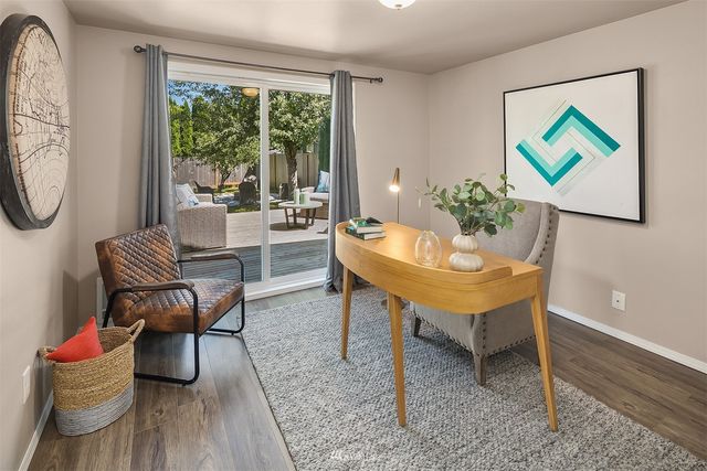 a living room with furniture and a gate
