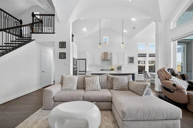 a living room with furniture white walls and white walls