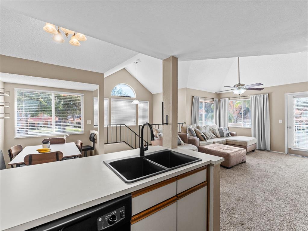 7705 Waterview Way, Unit 7705 Winter Haven, FL 33884 - Photo 12 of 33 a view of living room with furniture and large windows