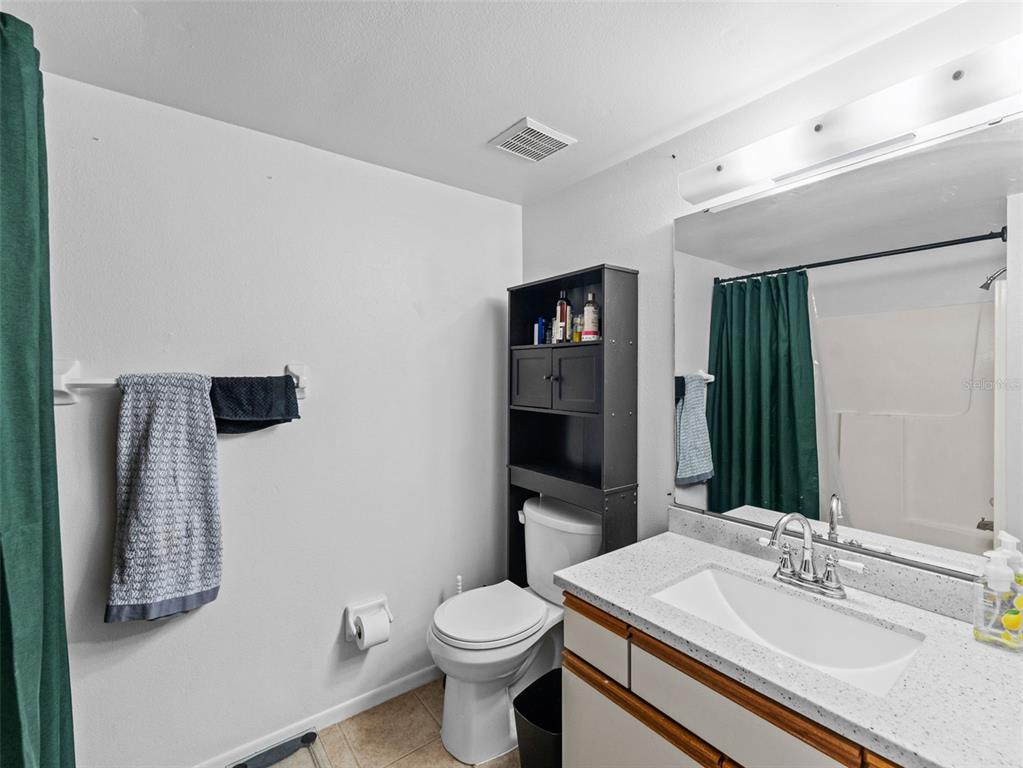 7705 Waterview Way, Unit 7705 Winter Haven, FL 33884 - Photo 13 of 33 a bathroom with a sink toilet and shower