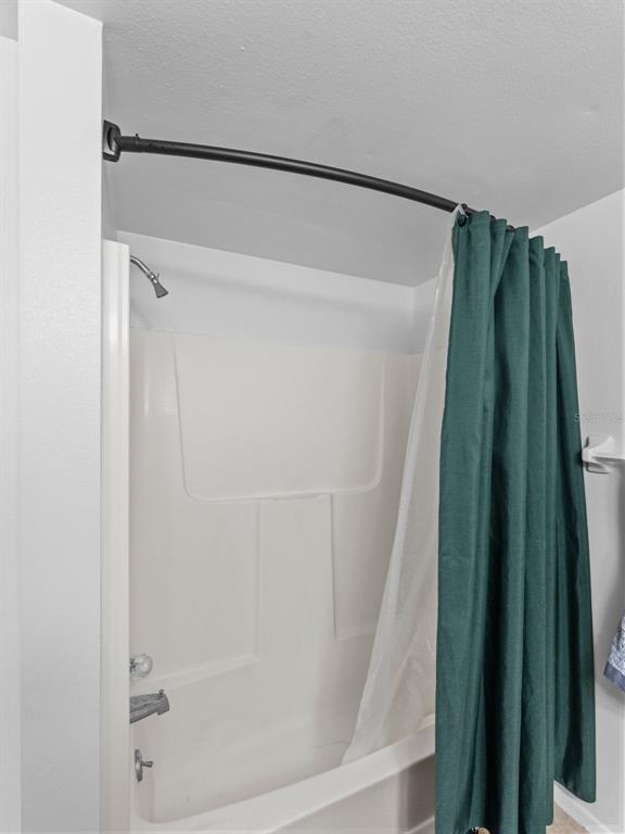 7705 Waterview Way, Unit 7705 Winter Haven, FL 33884 - Photo 14 of 33 a close up of a shower