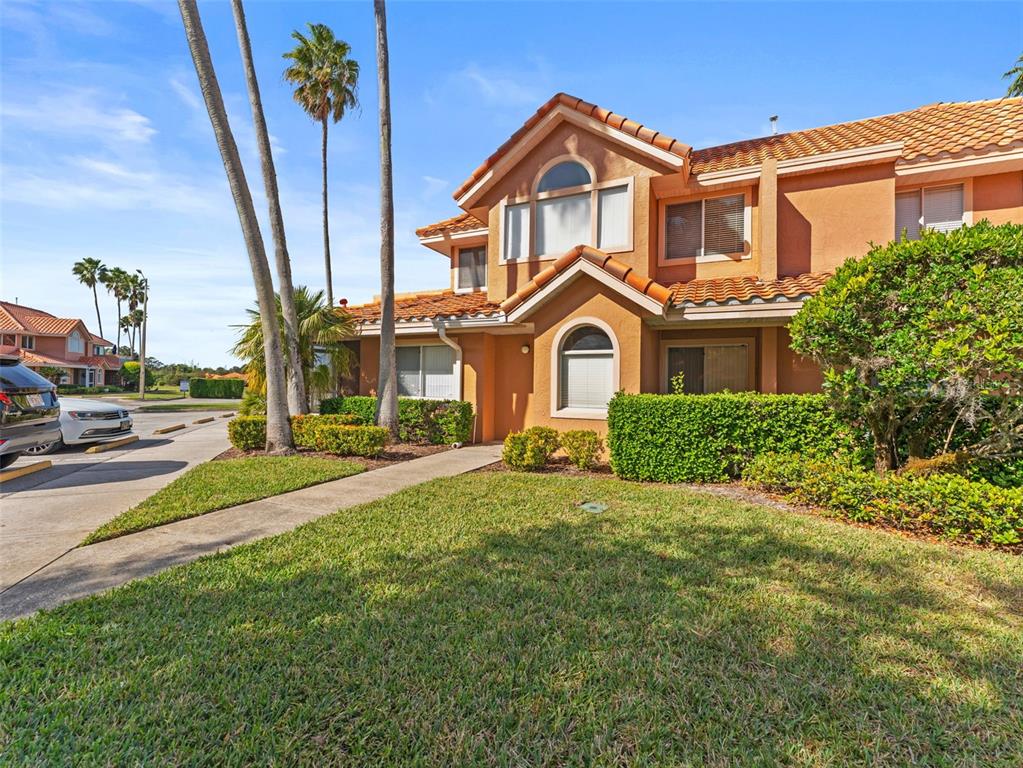 7705 Waterview Way, Unit 7705 Winter Haven, FL 33884 - Photo 2 of 33 a front view of a house with a yard