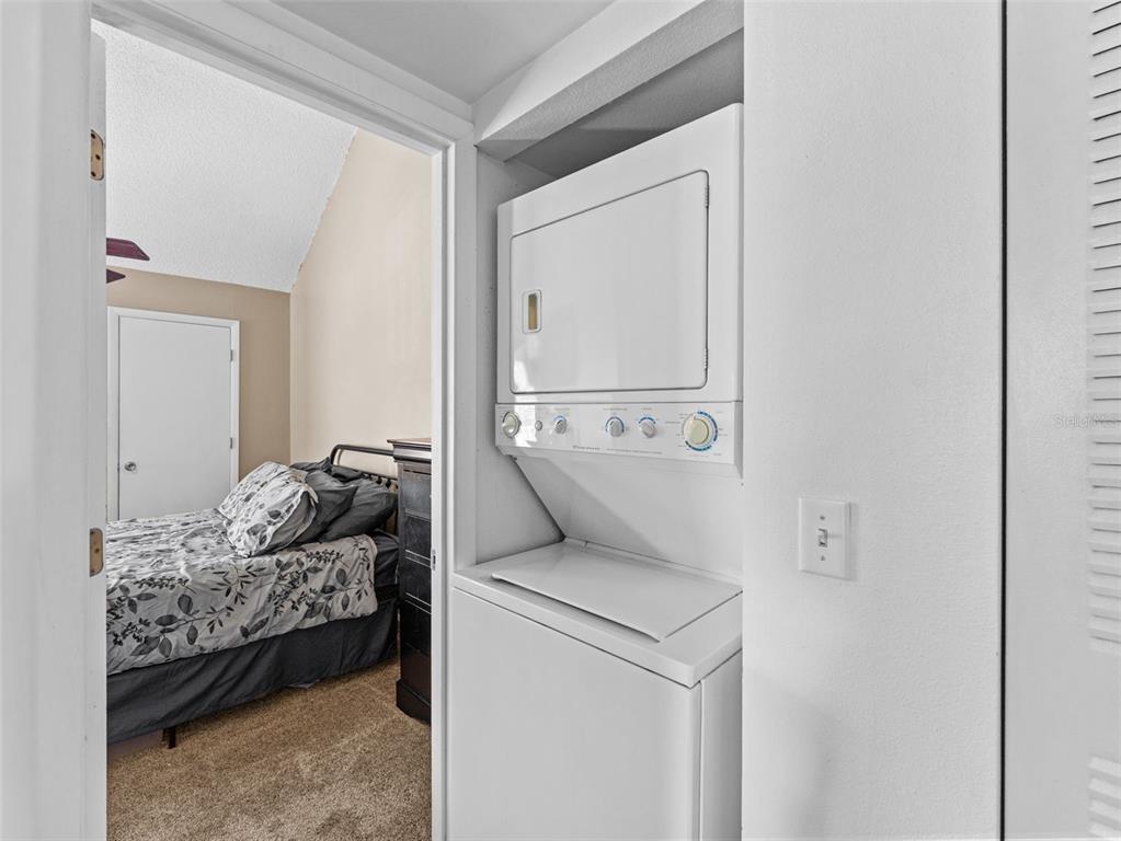 7705 Waterview Way, Unit 7705 Winter Haven, FL 33884 - Photo 22 of 33 a en suite bathroom with a toilet sink and mirror