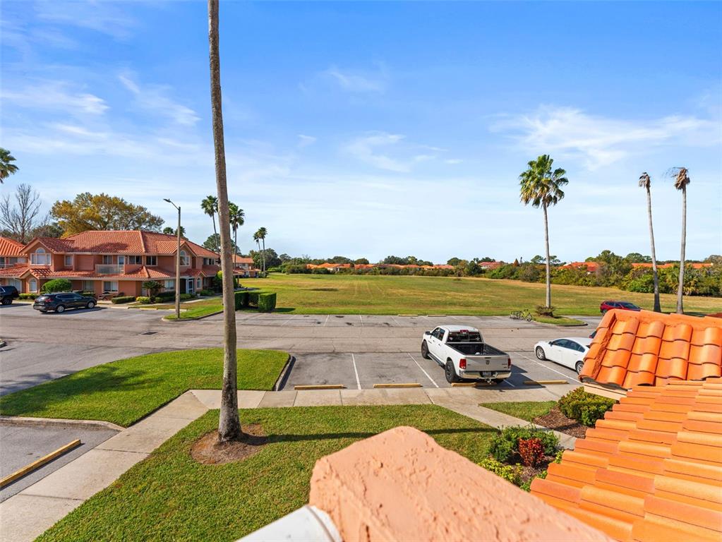 7705 Waterview Way, Unit 7705 Winter Haven, FL 33884 - Photo 25 of 33 a view of a lake with a table and chairs