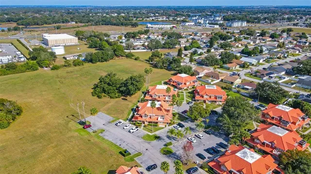 an aerial view of residential houses with outdoor space