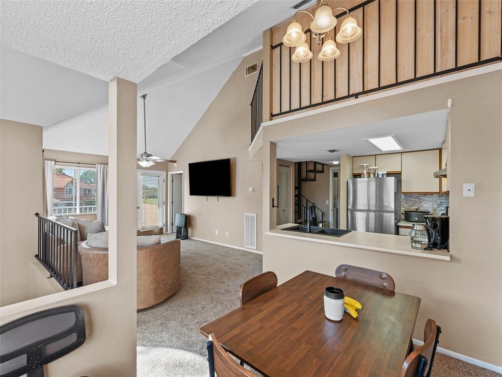7705 Waterview Way, Unit 7705 Winter Haven, FL 33884 - Photo 10 of 33 a living room with furniture and flat screen tv