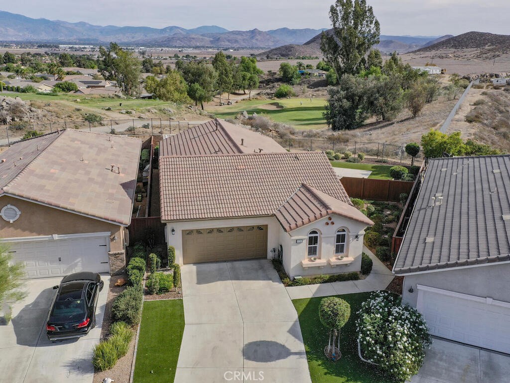 128 Lopez Way Hemet, CA 92545 - Photo 24 of 36 an aerial view of a house with a yard