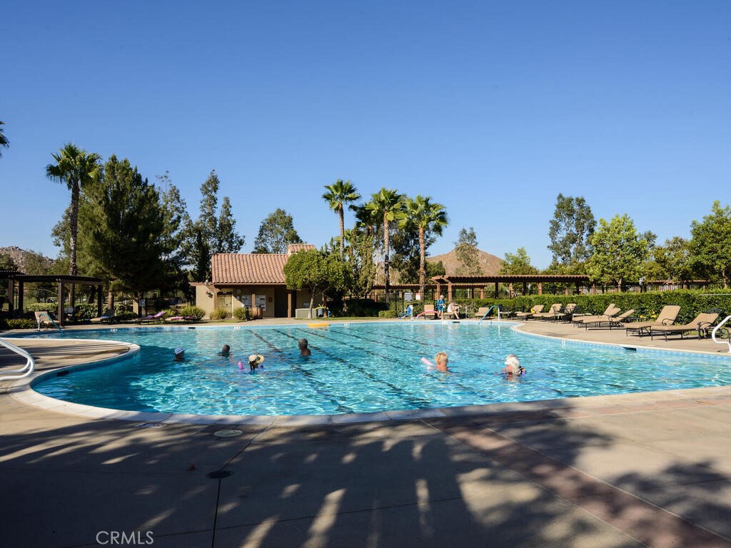 128 Lopez Way Hemet, CA 92545 - Photo 32 of 36 a front view of a house with a yard and garage