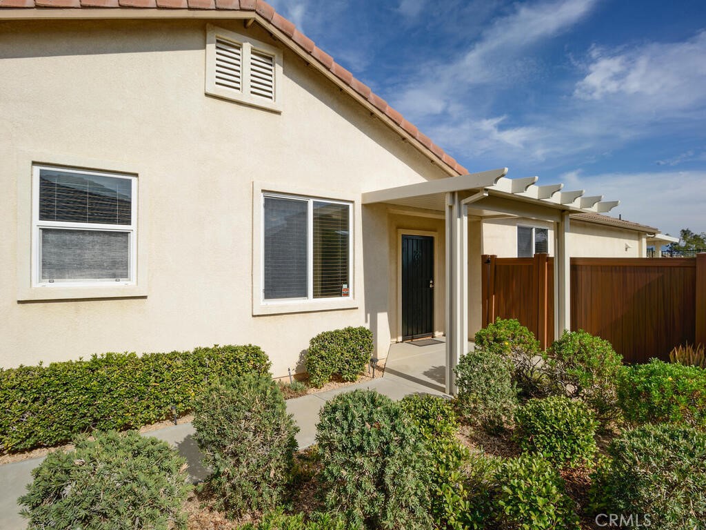 128 Lopez Way Hemet, CA 92545 - Photo 4 of 36 front view of a house with a yard