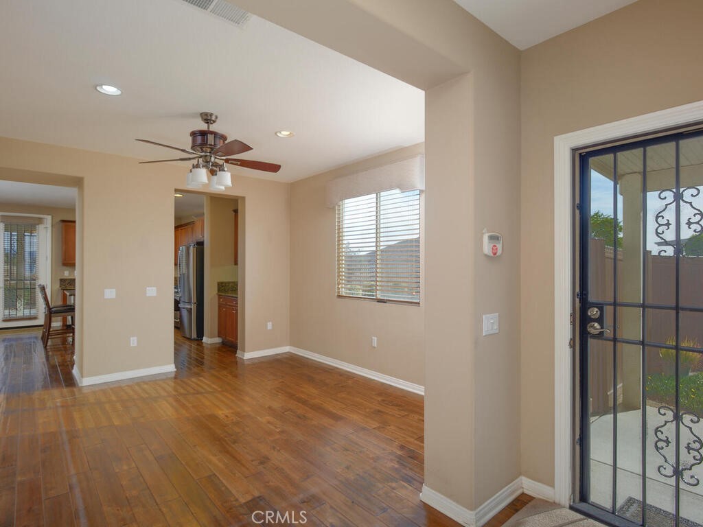 128 Lopez Way Hemet, CA 92545 - Photo 5 of 36 wooden floor in an empty room with a window