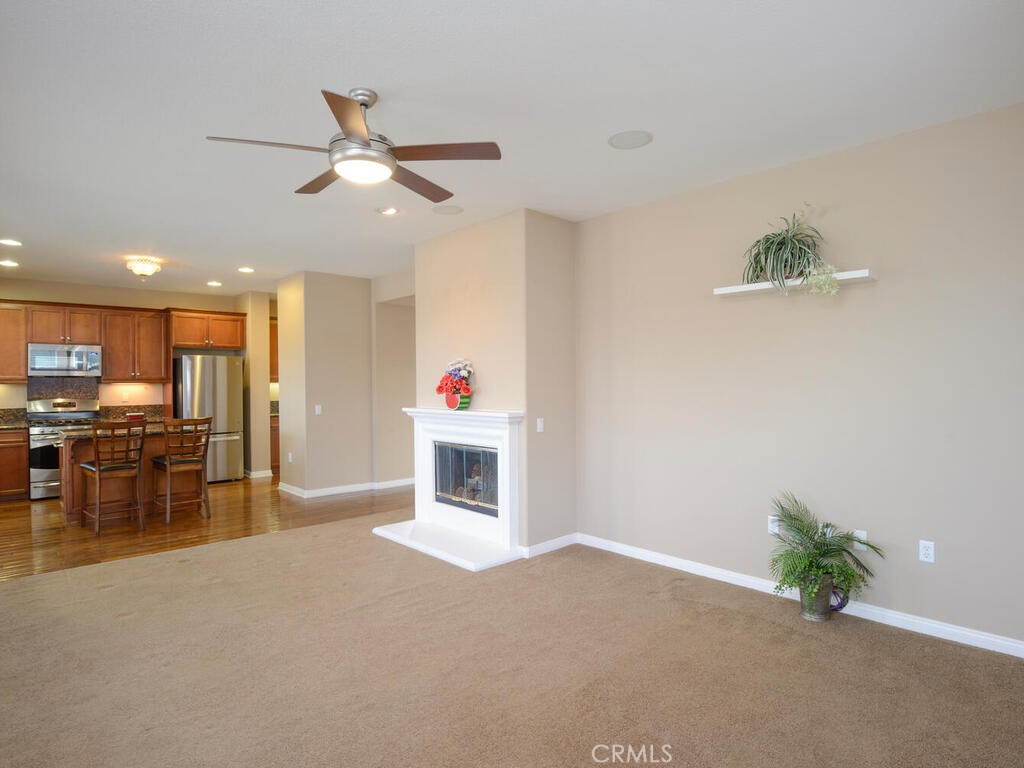128 Lopez Way Hemet, CA 92545 - Photo 8 of 36 a view of a livingroom with furniture and a ceiling fan
