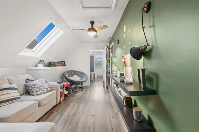 a bedroom with furniture and a chandelier