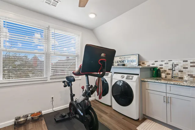 a view of a room with washer and dryer