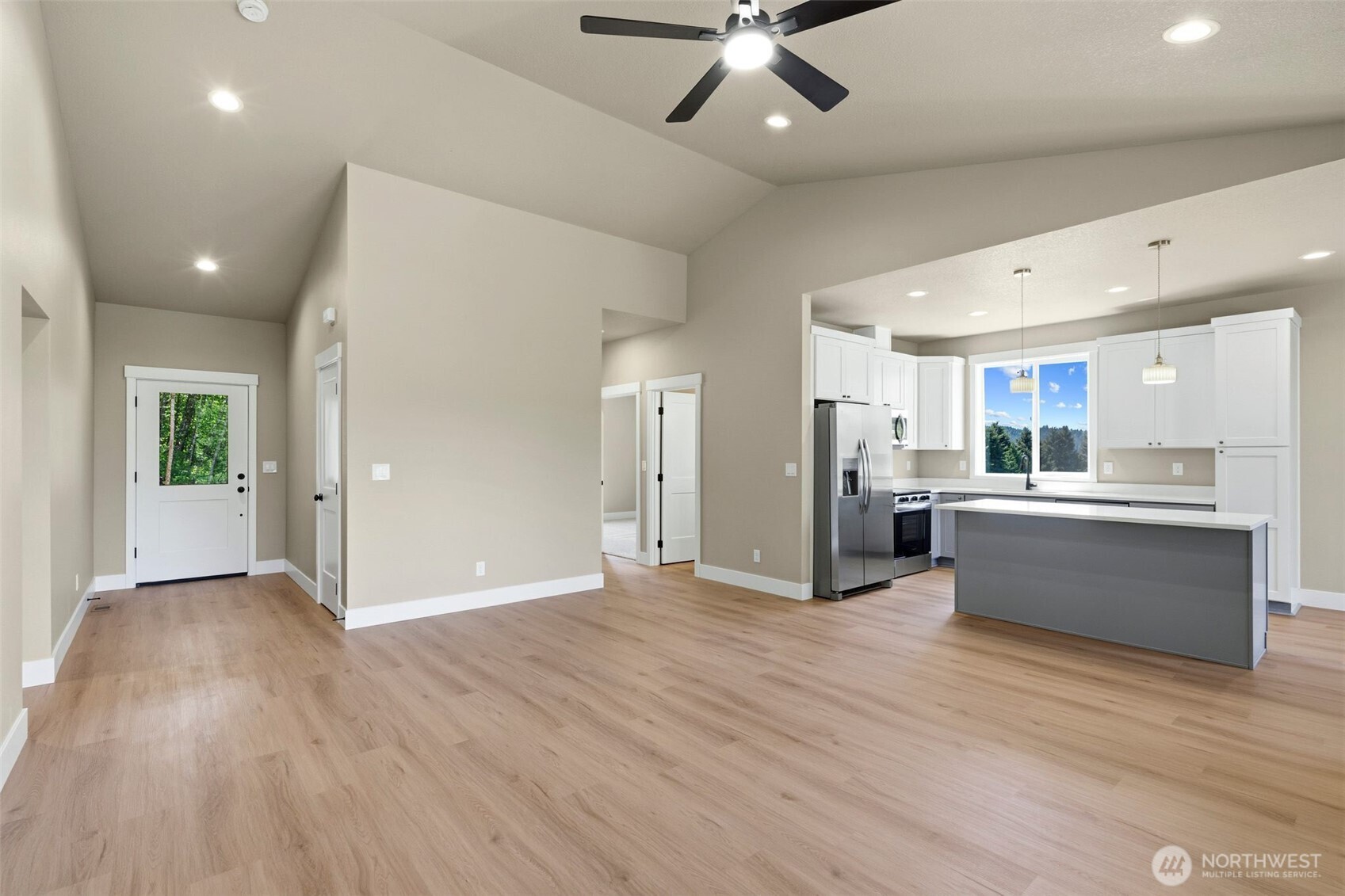 254 Windy Ridge Drive Longview, WA 98632 - Photo 15 of 27 a view of a kitchen with wooden floor and a kitchen