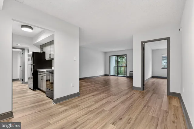 a view of a kitchen from the hallway
