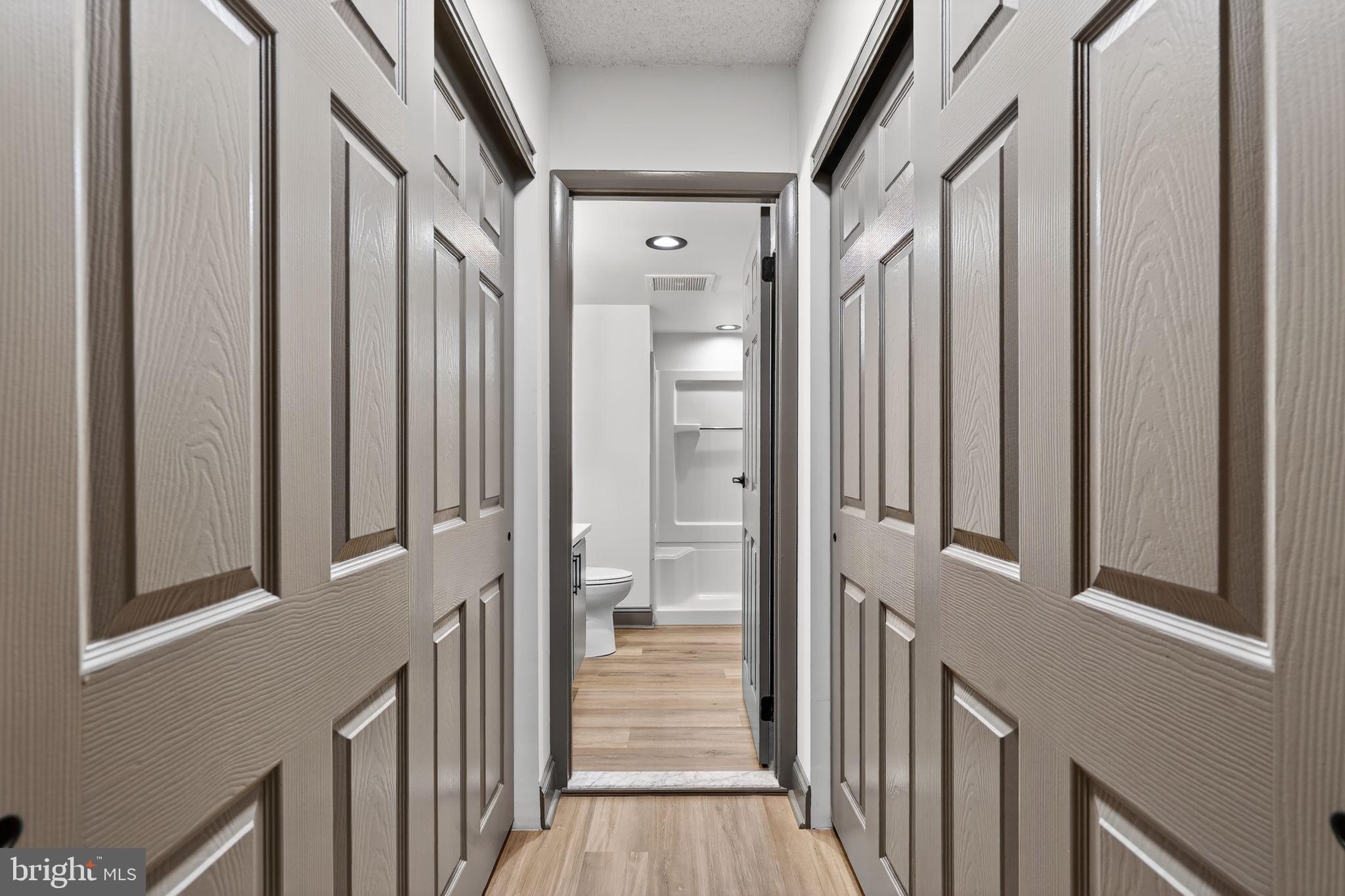 800 Avondale Road, Unit 2C Wallingford, PA 19086 - Photo 20 of 35 Double Closets & Hallway into Primary Bathroom