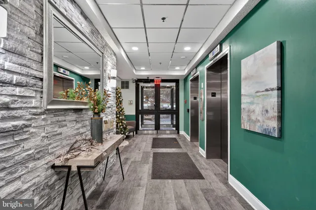 a view of a porch with furniture and a yard