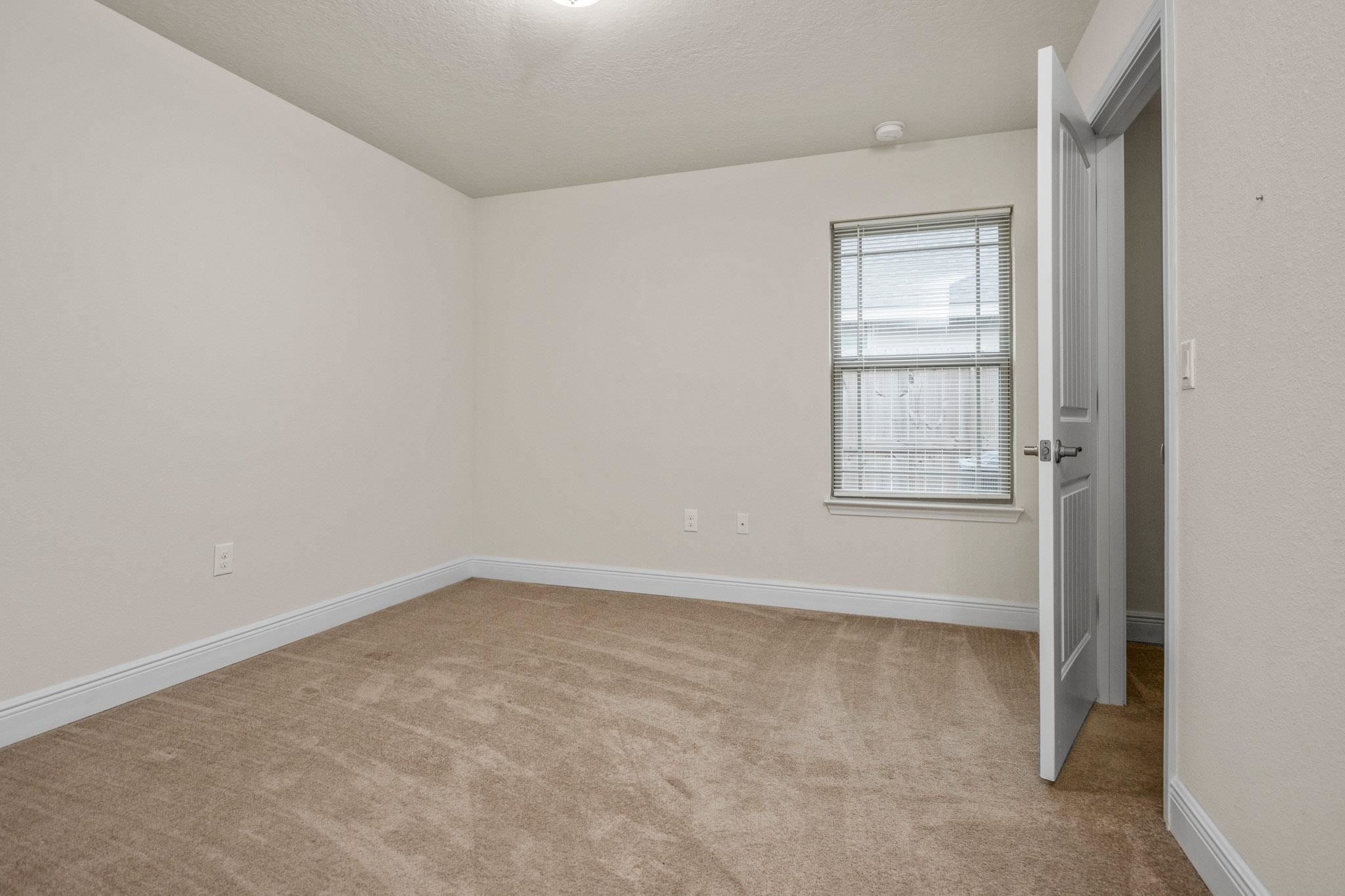 5070 Carmell Ridge Circle Milton, FL 32570 - Photo 18 of 36 an empty room with windows