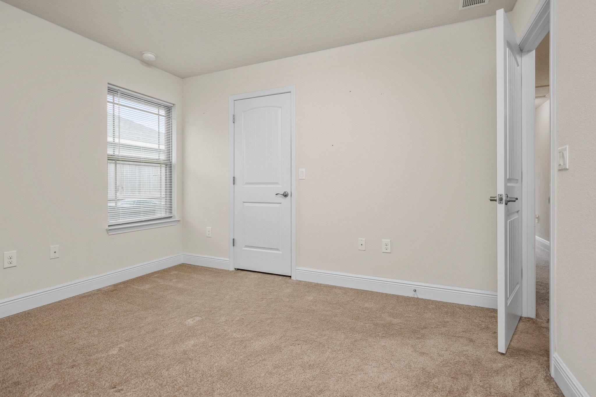 5070 Carmell Ridge Circle Milton, FL 32570 - Photo 19 of 36 a view of an empty room with a window