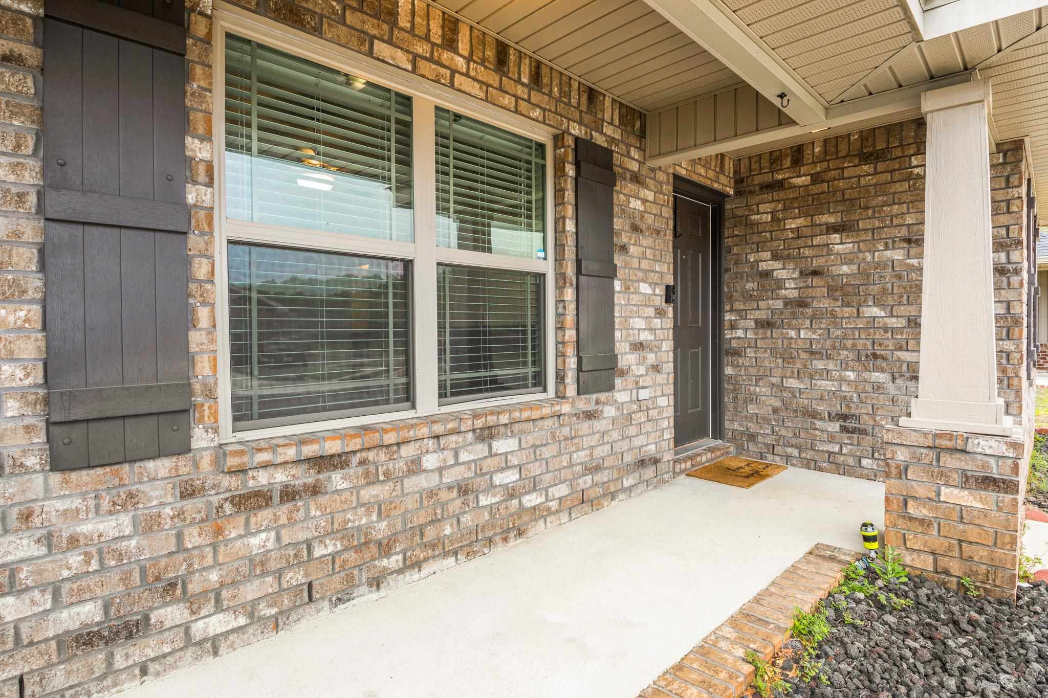 5070 Carmell Ridge Circle Milton, FL 32570 - Photo 2 of 36 a view of a door and a window