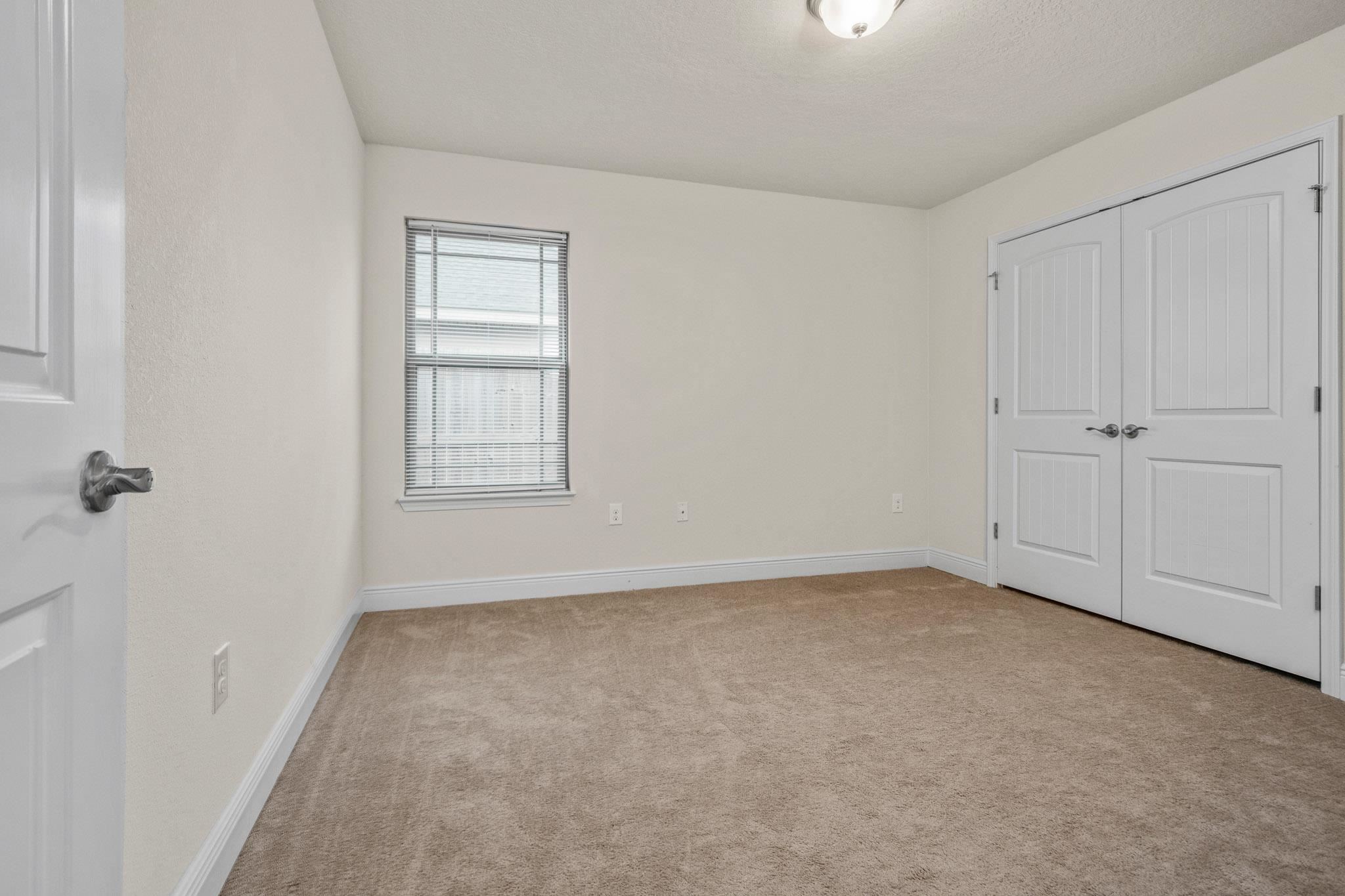 5070 Carmell Ridge Circle Milton, FL 32570 - Photo 22 of 36 a view of an empty room with a window
