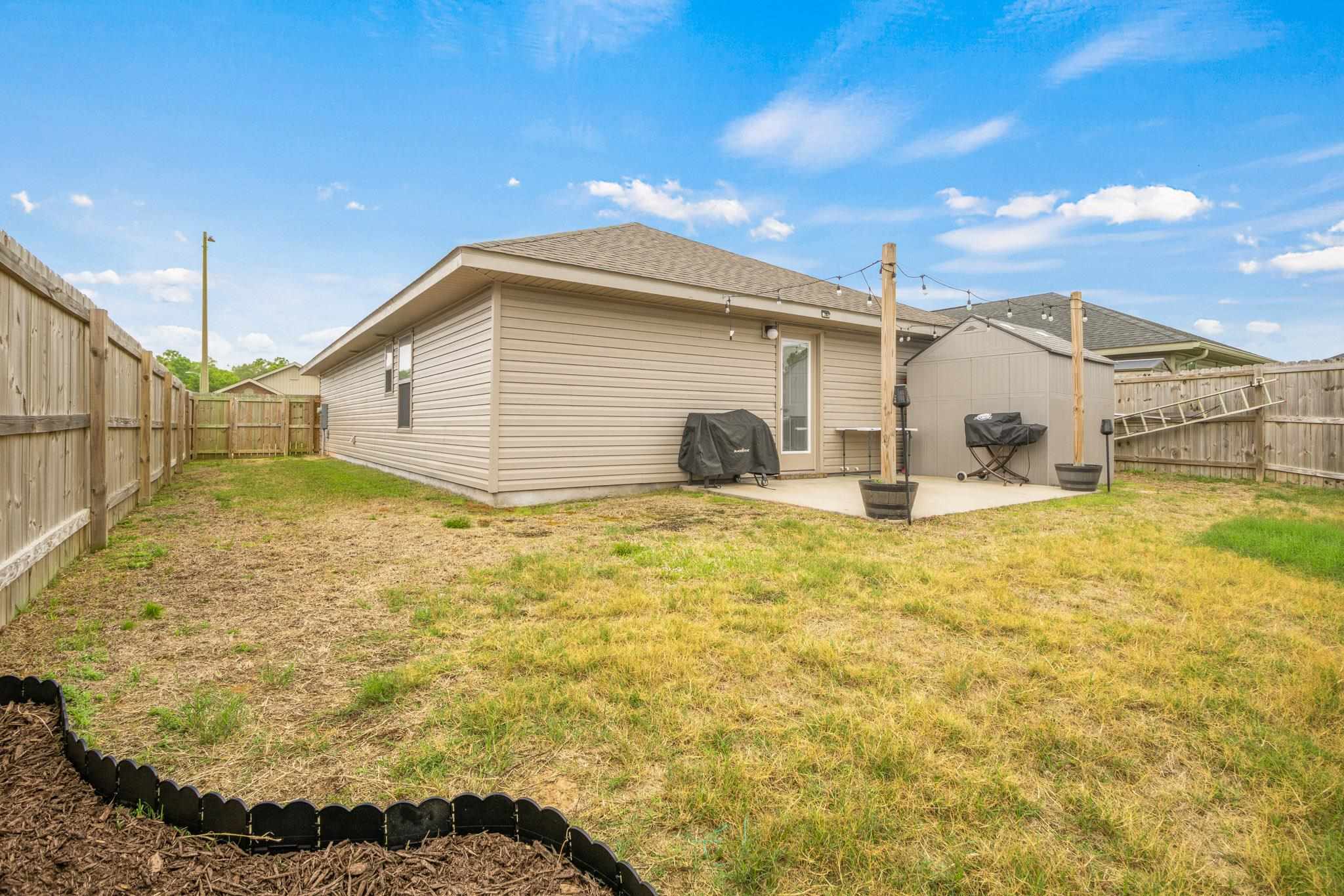 5070 Carmell Ridge Circle Milton, FL 32570 - Photo 32 of 36 a bathroom with a sink and mirror