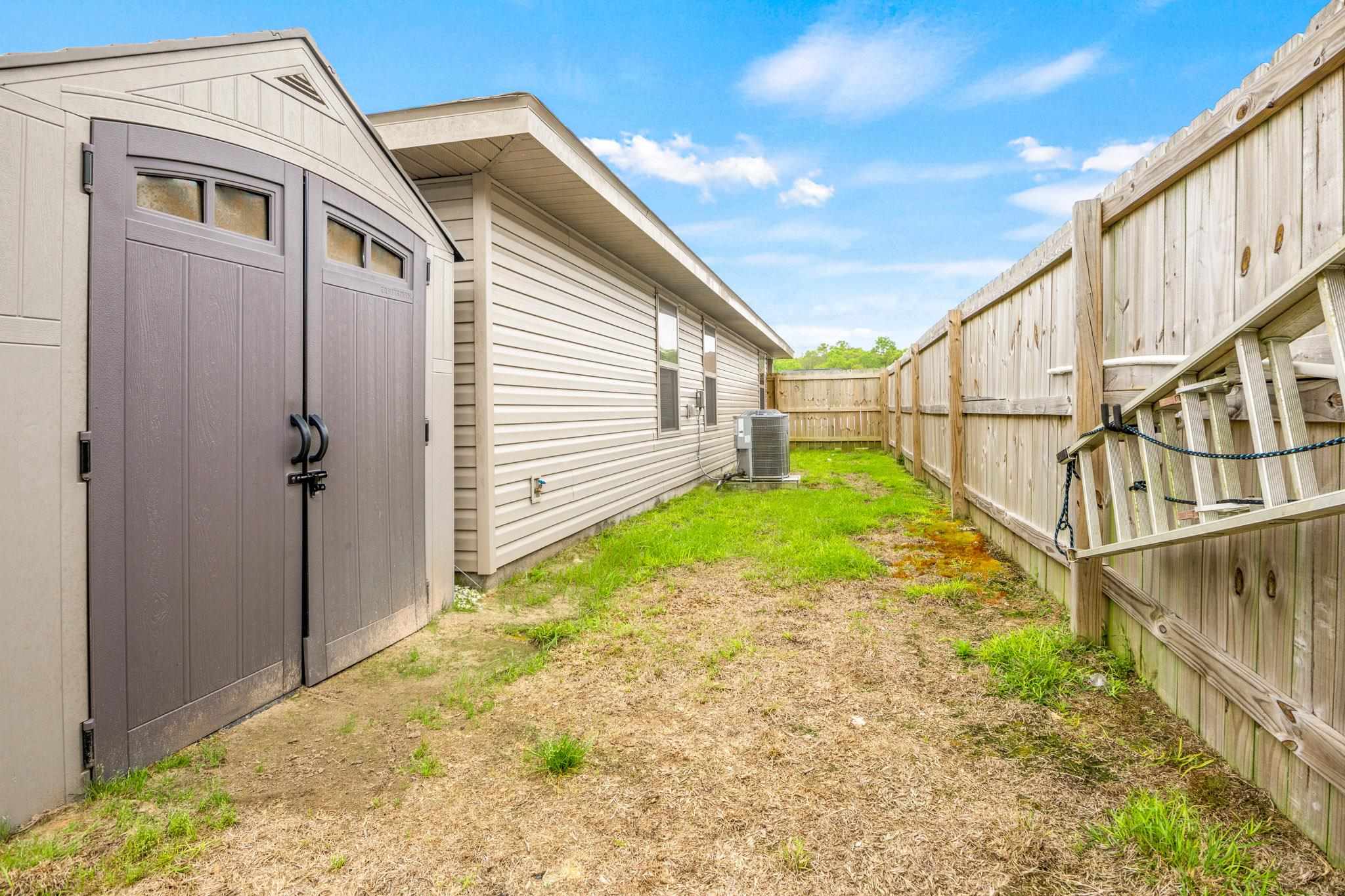 5070 Carmell Ridge Circle Milton, FL 32570 - Photo 34 of 36 a view of yard with wooden fence