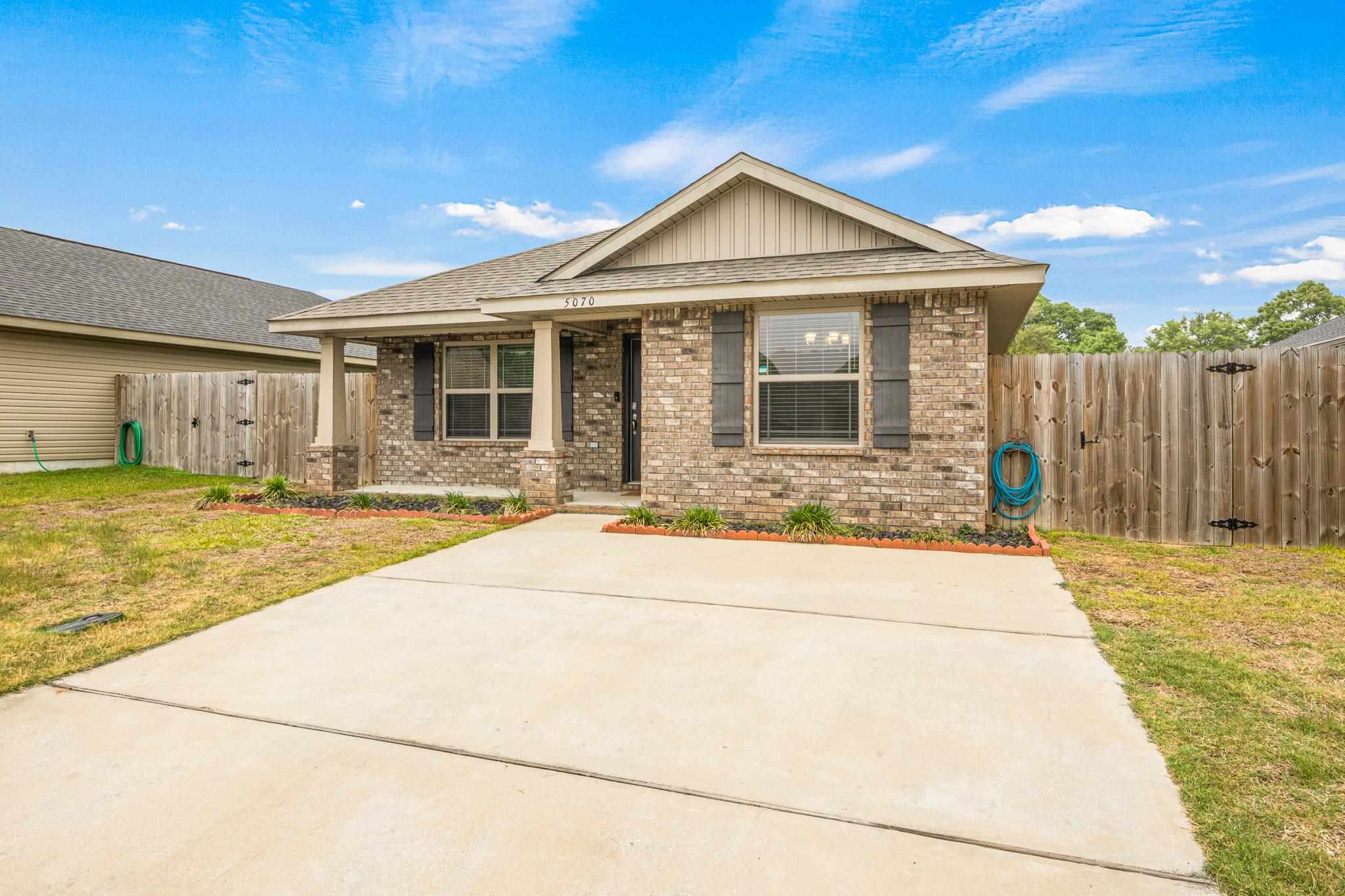 5070 Carmell Ridge Circle Milton, FL 32570 - Photo 36 of 36 a view of a house with a swimming pool