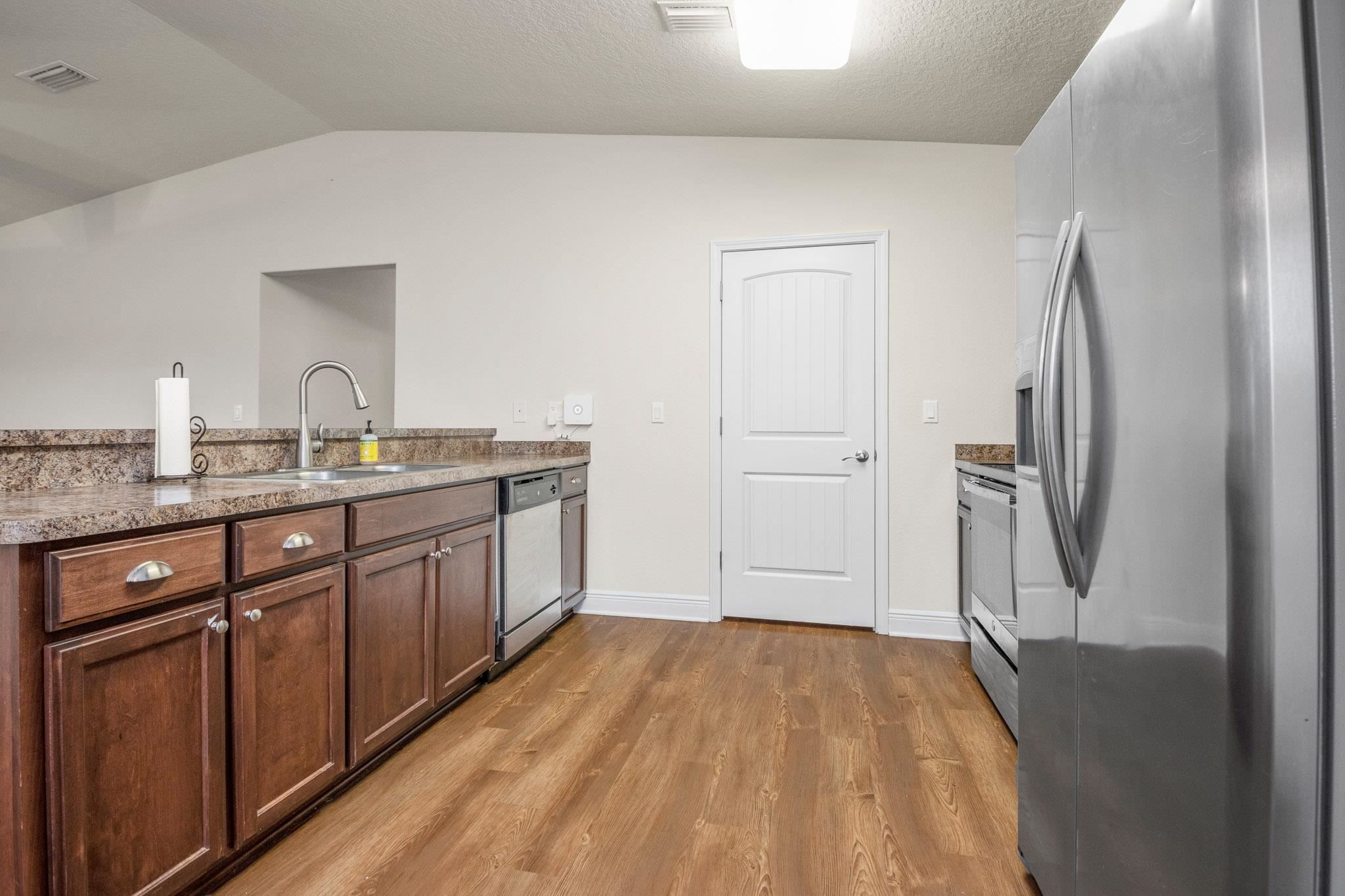 5070 Carmell Ridge Circle Milton, FL 32570 - Photo 10 of 36 a spacious bathroom with a granite countertop sink mirror and refrigerator