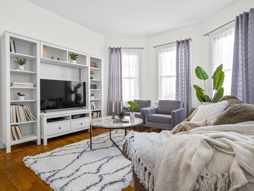 8 Marbury Terrace, Unit 1 Boston, MA 02130 - Photo 1 of 35 a living room with furniture and a flat screen tv