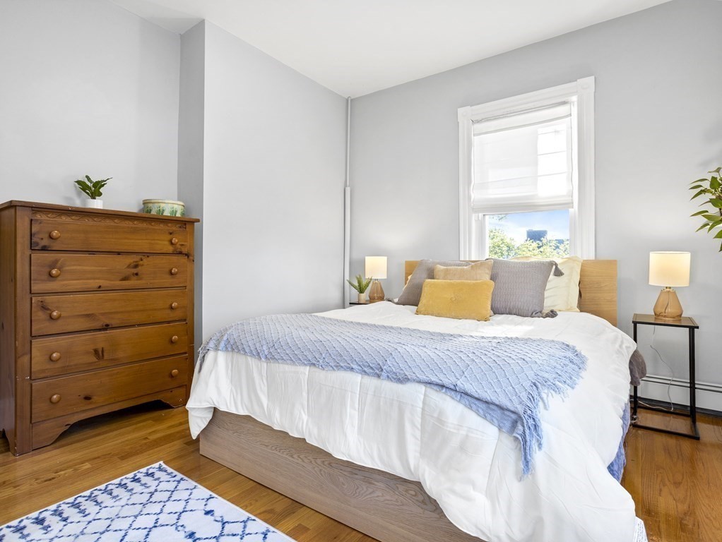 8 Marbury Terrace, Unit 1 Boston, MA 02130 - Photo 12 of 35 a bedroom with a bed and a window