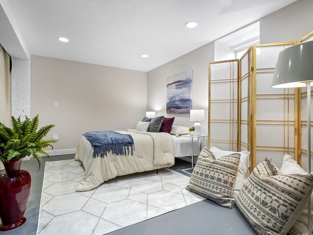 8 Marbury Terrace, Unit 1 Boston, MA 02130 - Photo 13 of 35 a bedroom with furniture and a window