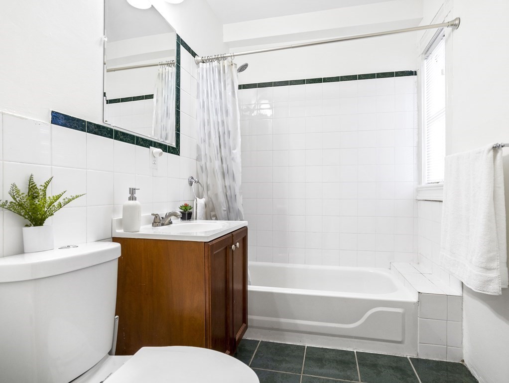 8 Marbury Terrace, Unit 1 Boston, MA 02130 - Photo 15 of 35 a bathroom with a sink toilet and shower