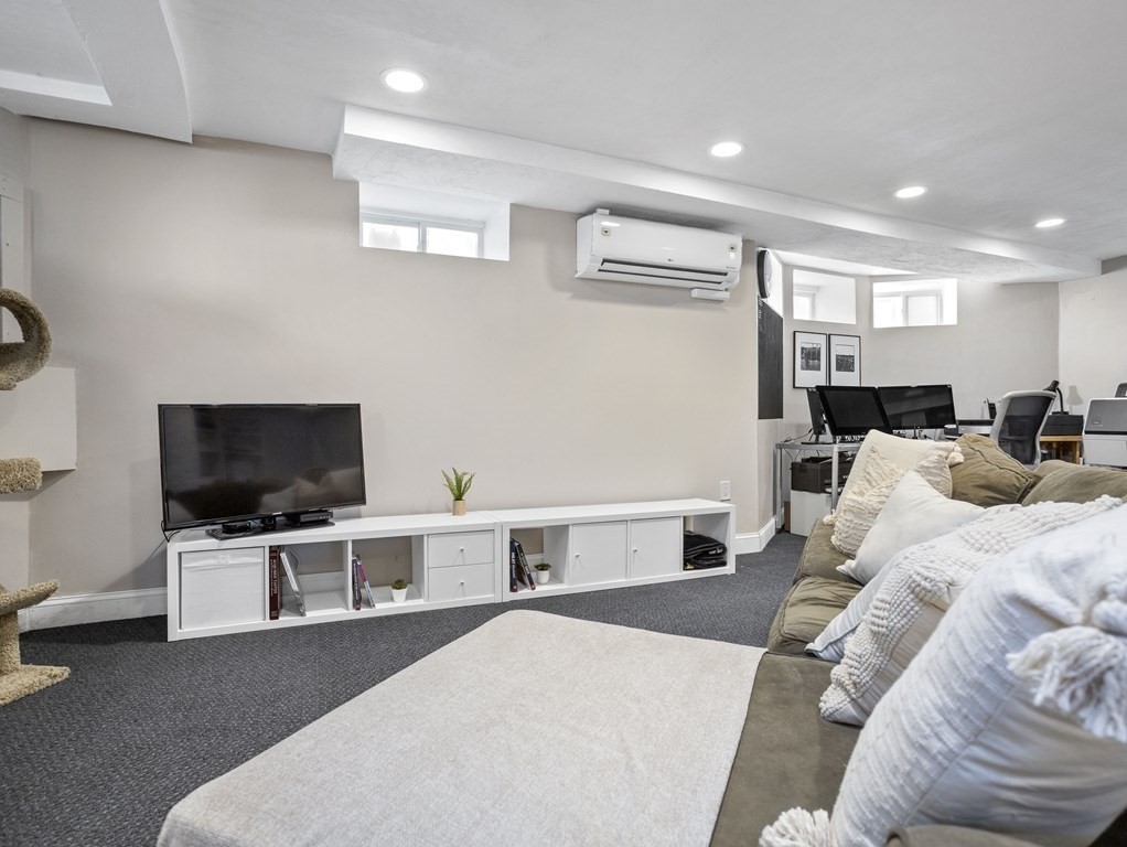 8 Marbury Terrace, Unit 1 Boston, MA 02130 - Photo 19 of 35 a living room with furniture and a flat screen tv