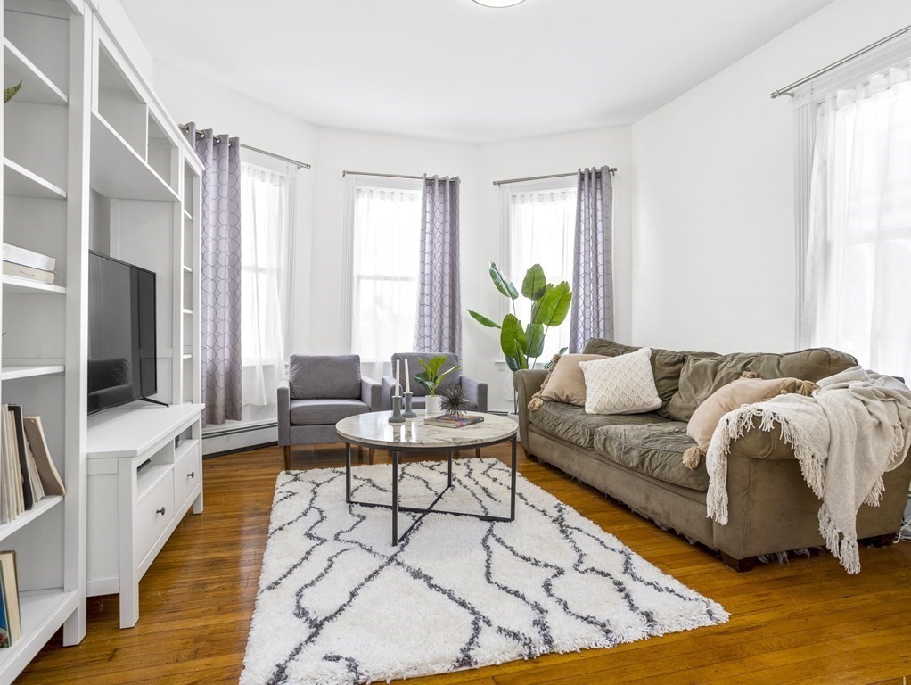 8 Marbury Terrace, Unit 1 Boston, MA 02130 - Photo 2 of 35 a living room with furniture and a flat screen tv